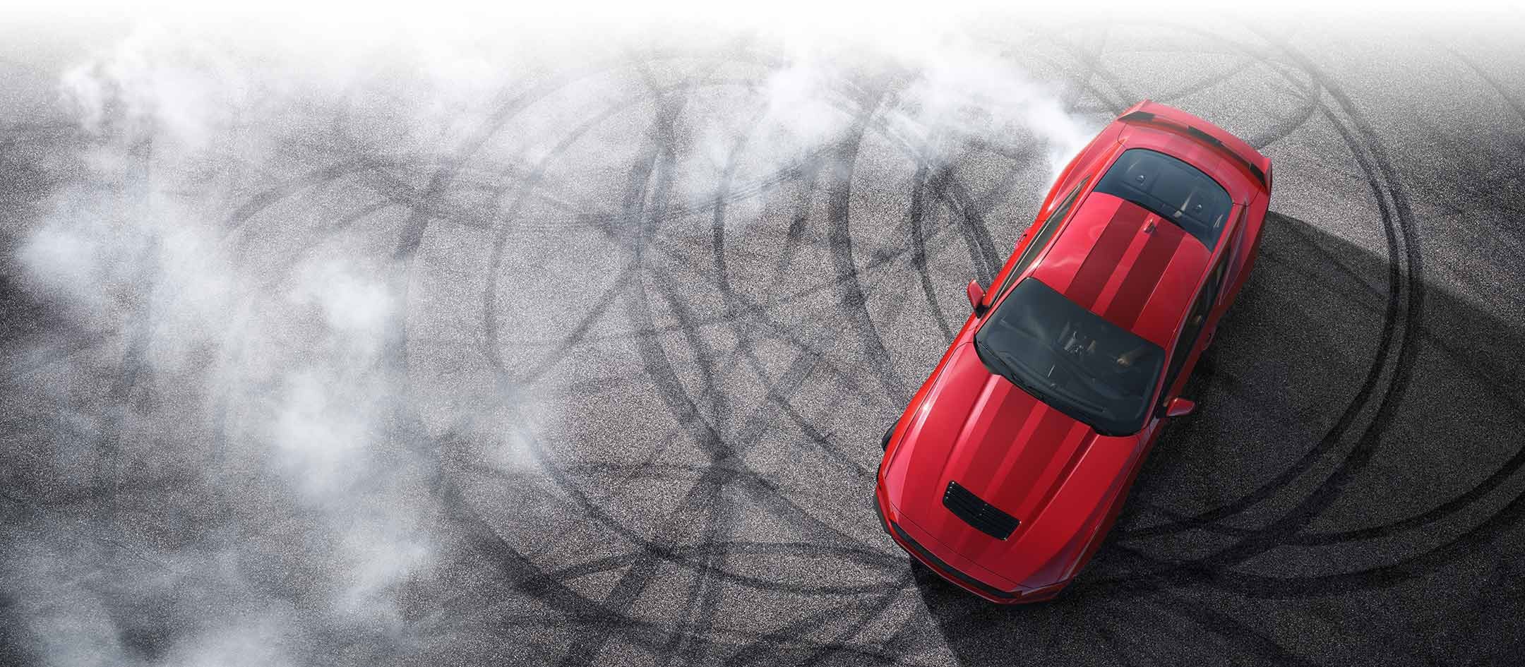 Overhead view of a 2024 Ford Mustang® model with tire tracks on pavement | Kline Ford in Winfield KS