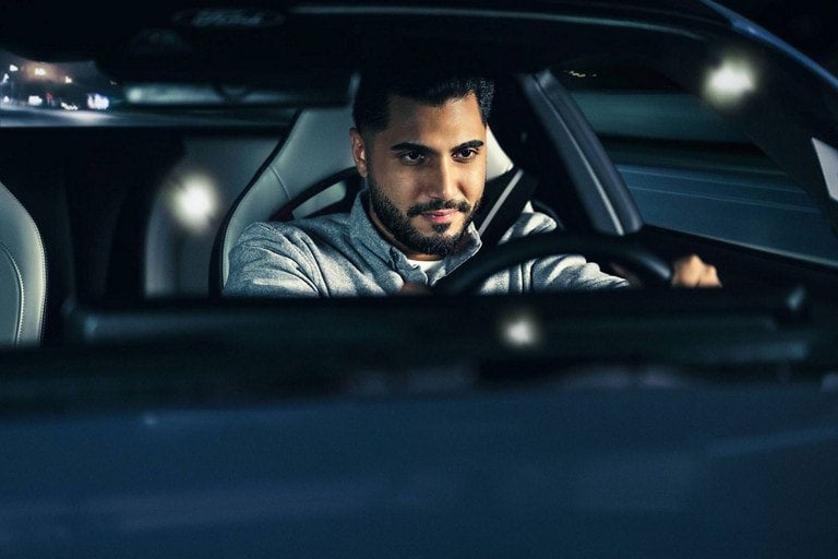Person sitting in the driver’s seat of a parked 2024 Ford Mustang® coupe | Kline Ford in Winfield KS